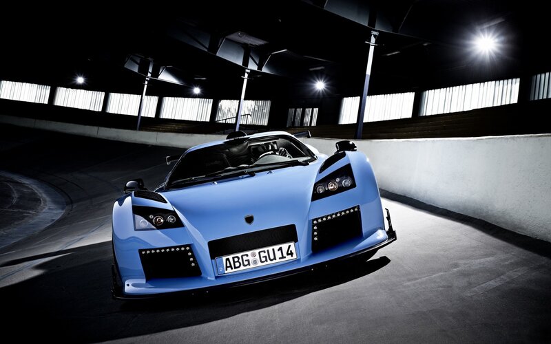 blue sports car on racetrack