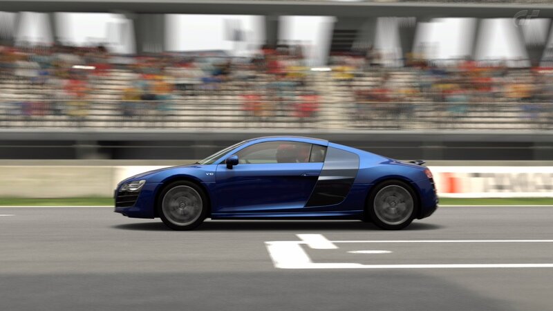 blue sports car on racetrack