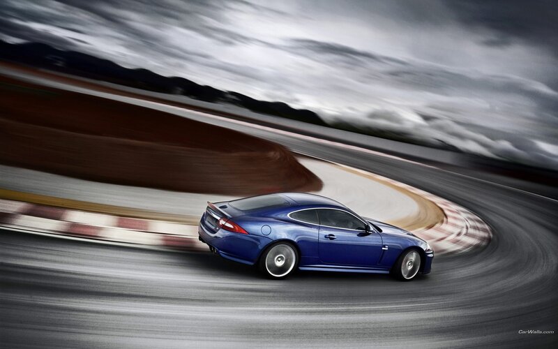 blue sports car on racetrack