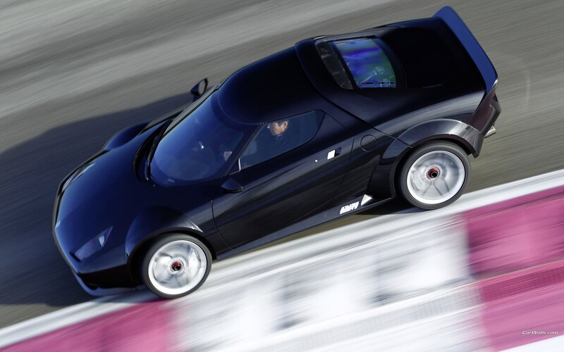 blue sports car on racetrack