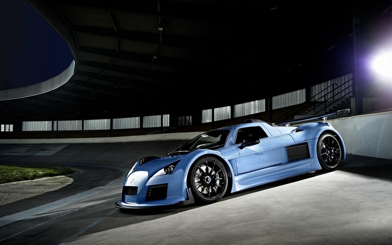blue sports car on racetrack