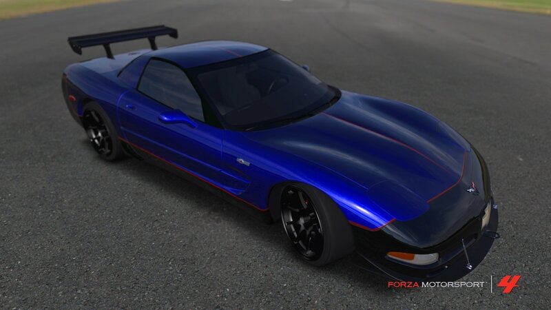 blue sports car on racetrack
