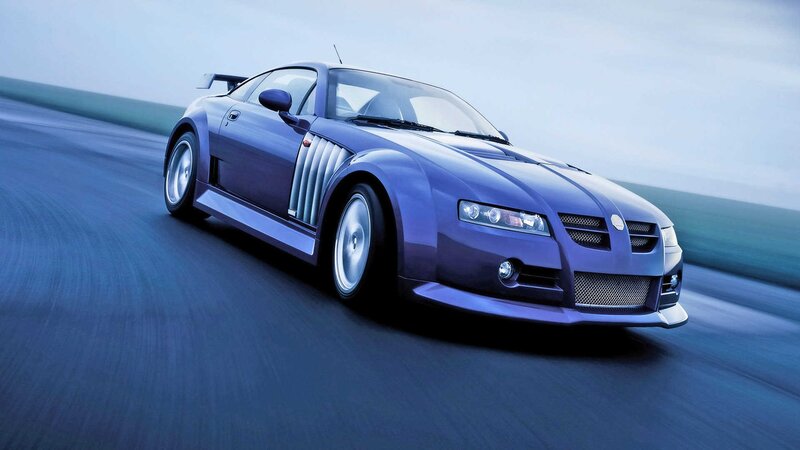 blue sports car on road