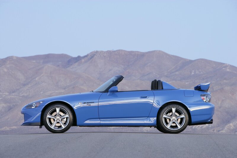 blue sports car on road
