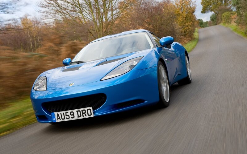 blue sports car on road