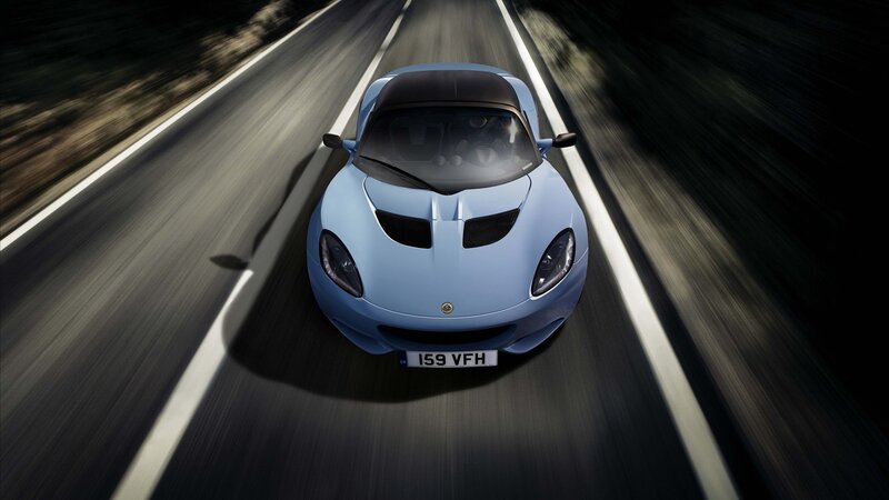 blue sports car on road