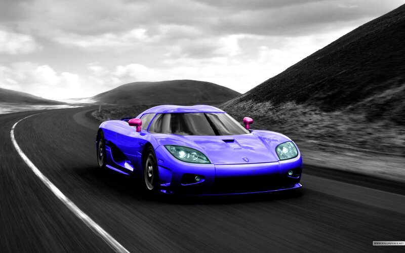 blue sports car on road