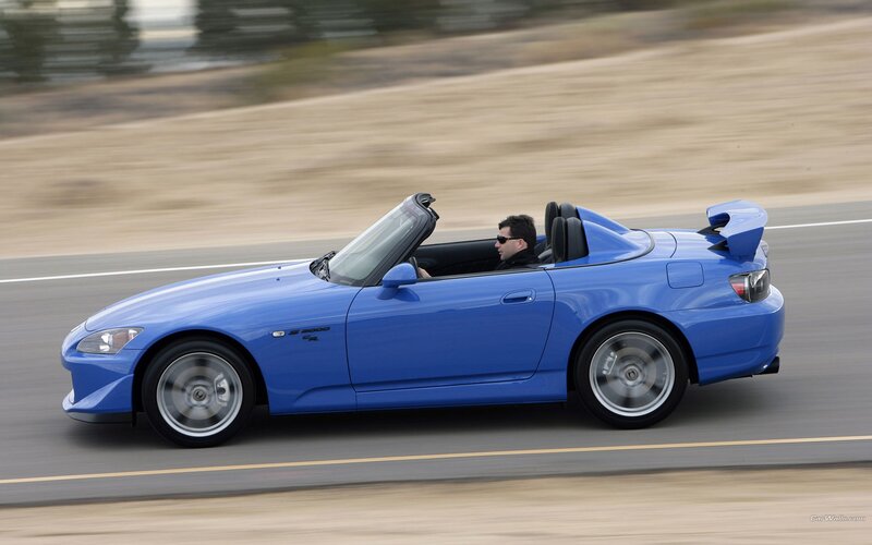 blue sports car on road