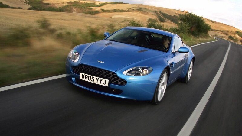 blue sports car on road