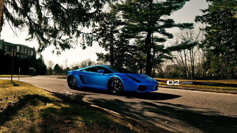 blue sports car on road