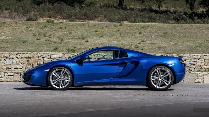 blue sports car on road