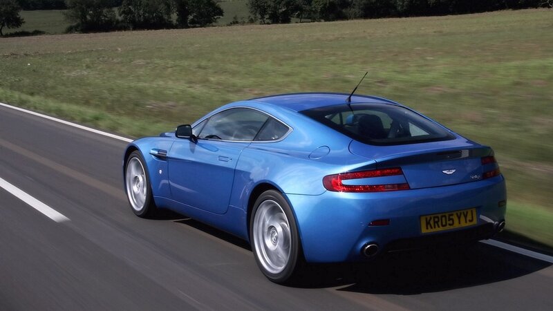 blue sports car on road