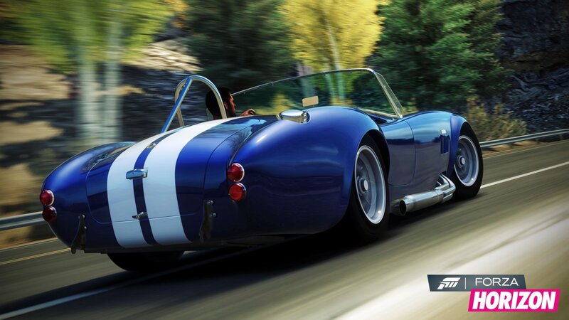 blue sports car on road