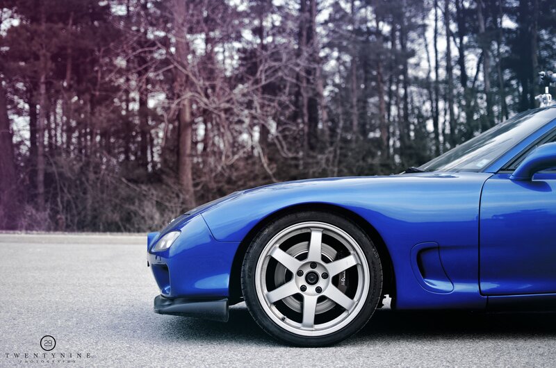 blue sports car on road
