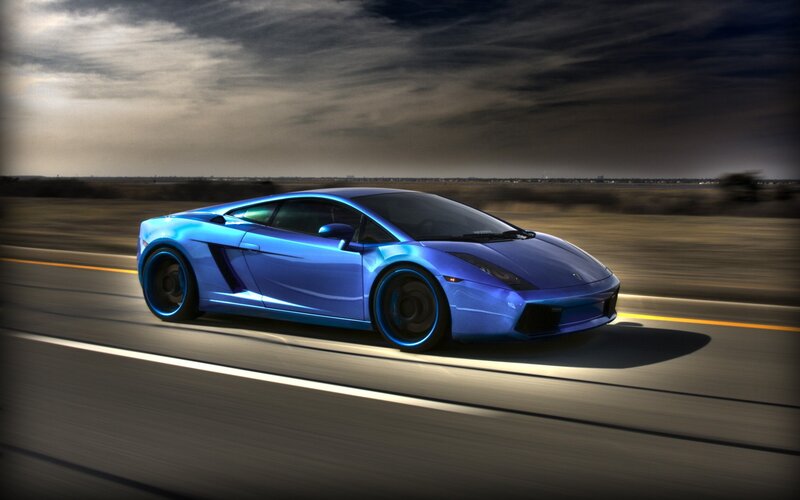 blue sports car on road