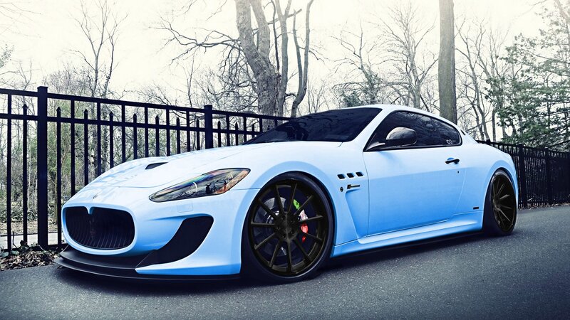 blue sports car on road