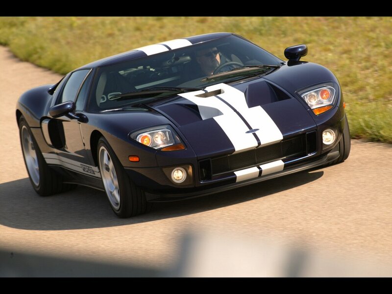 blue sports car on road