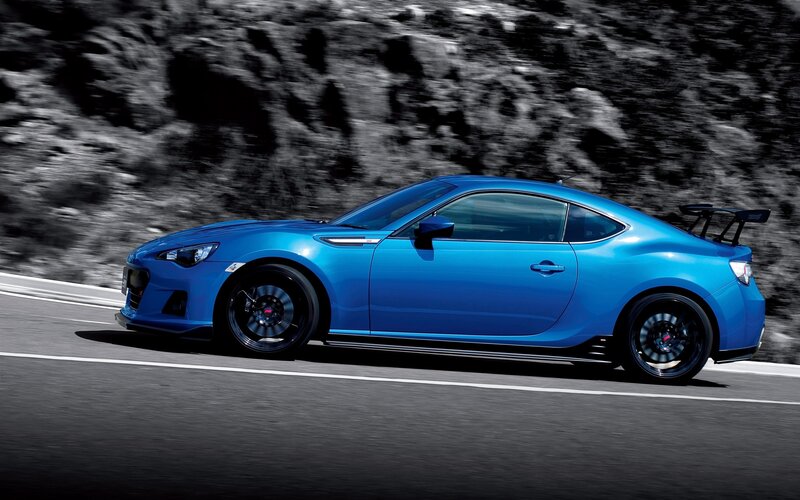 blue sports car on road