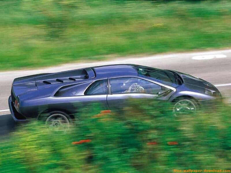 blue sports car on road