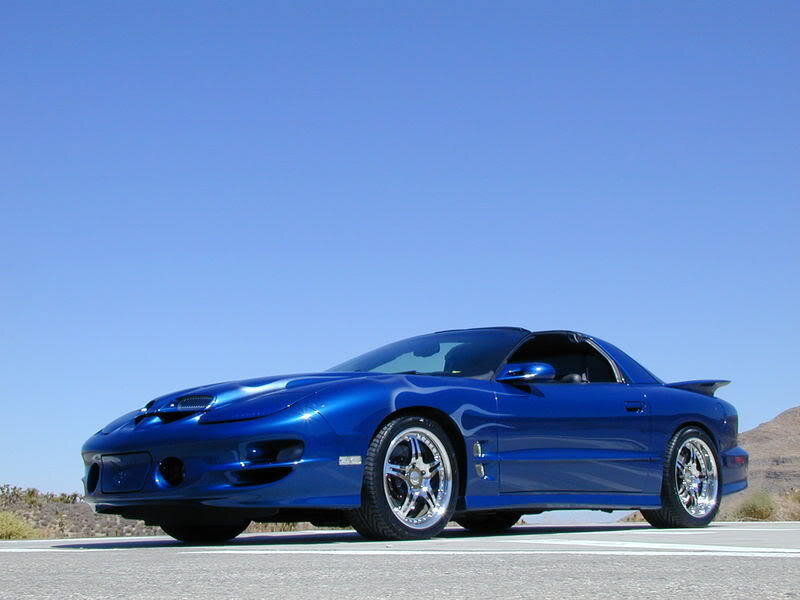 blue sports car on road