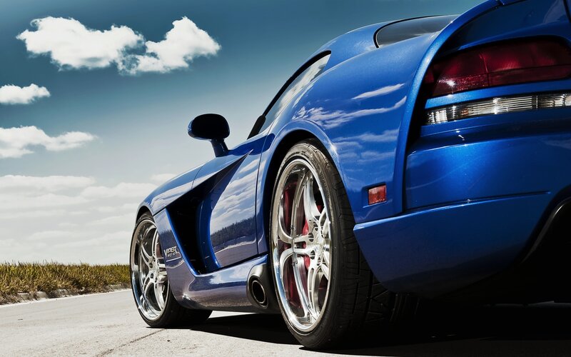 Blue sports car on road