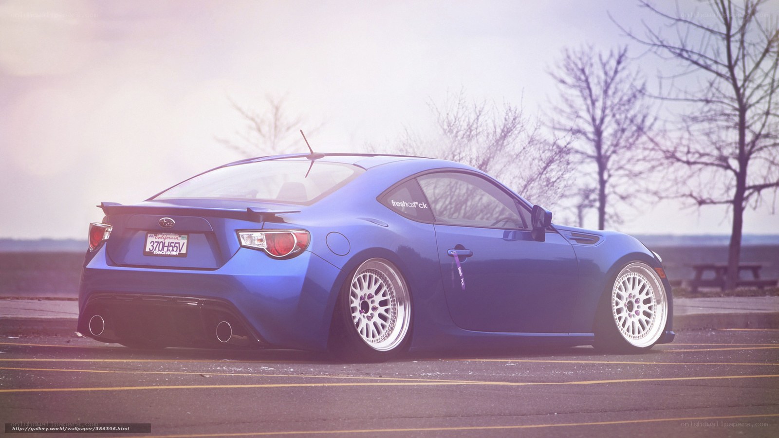 blue sports car on road