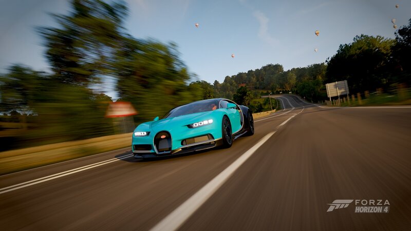 Blue Sports Car on Road — Cyan
