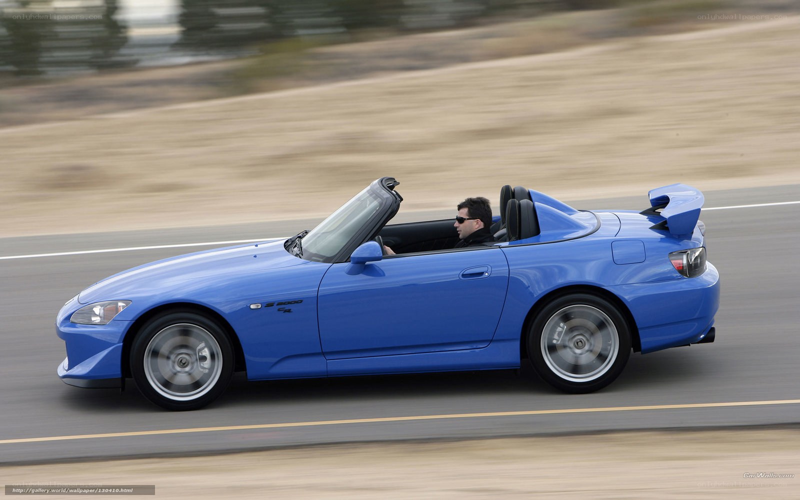 blue sports car on road