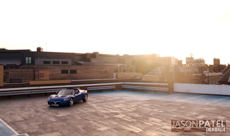 Blue sports car on rooftop