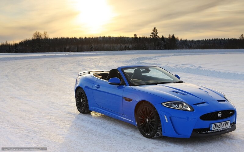 Blue sports car on snowy field