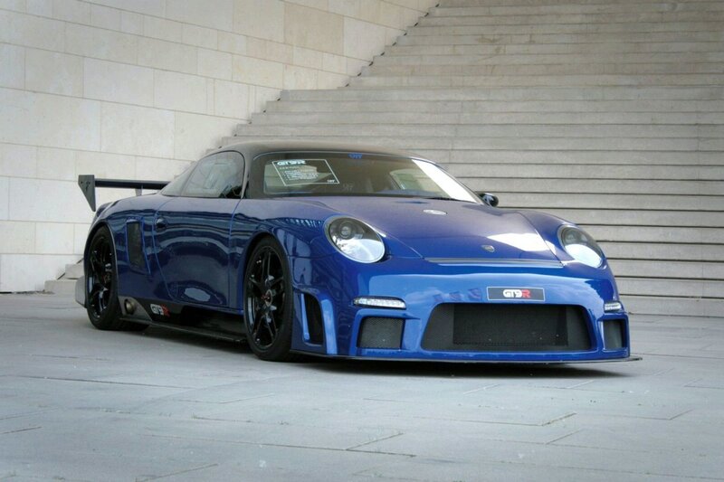 blue sports car on stairs