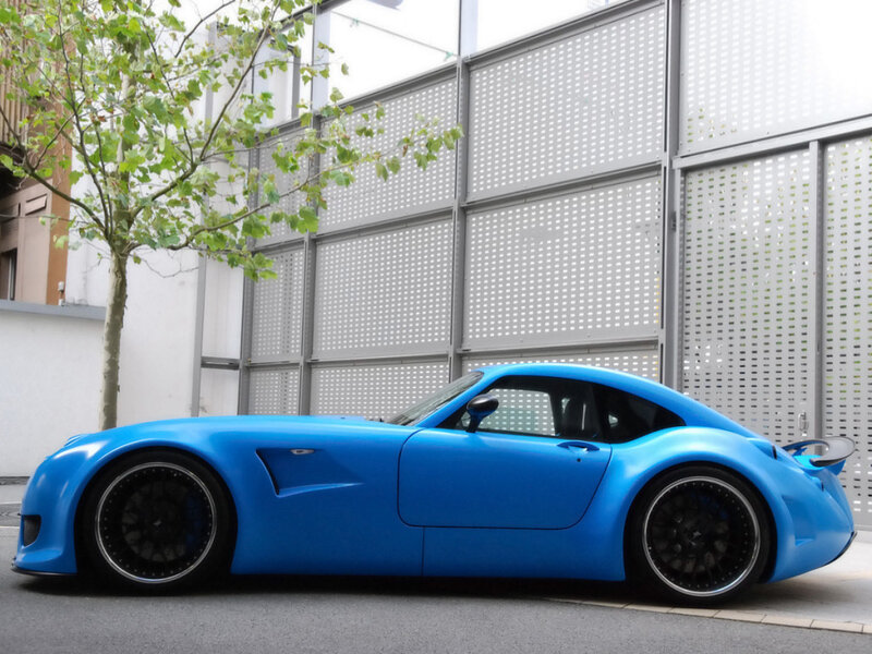 blue sports car on street