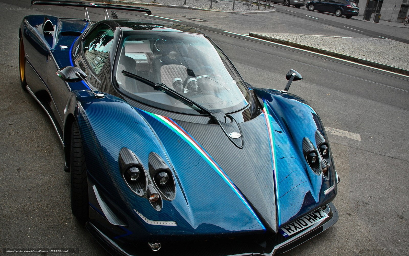 blue sports car on street