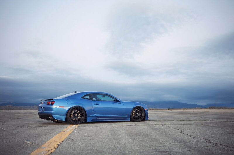 Blue sports car on tarmac