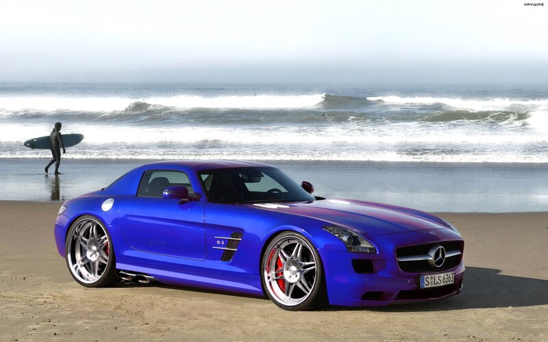 Blue sports car on the beach
