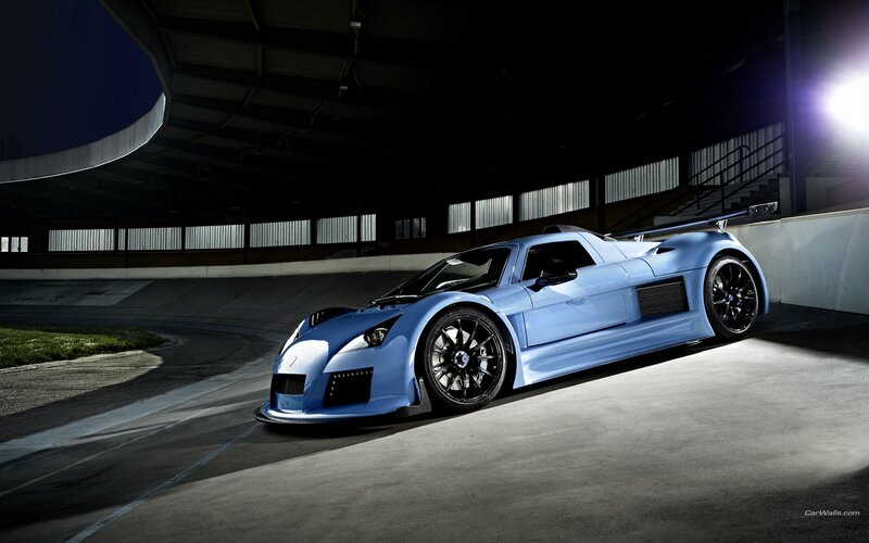 blue sports car on track
