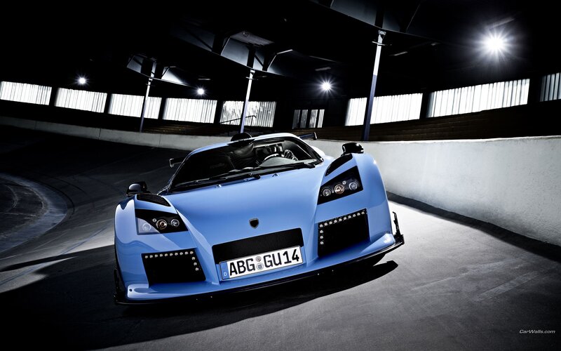 blue sports car on track