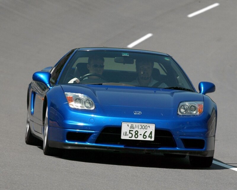 blue sports car on track