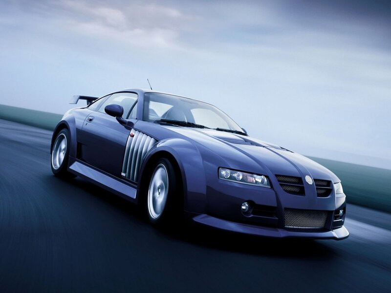 blue sports car on track