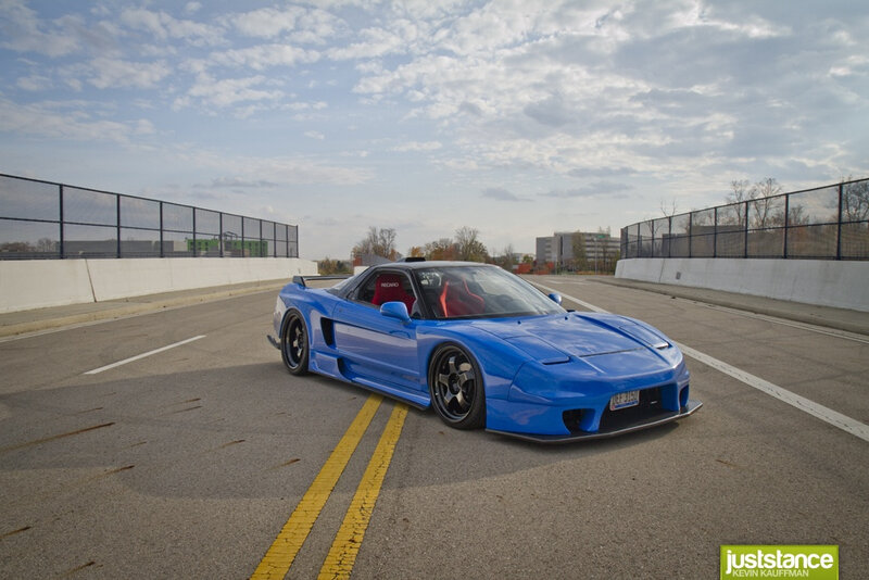 blue sports car on track