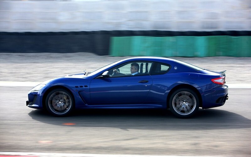blue sports car on track