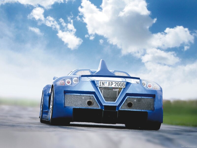 blue sports car on track