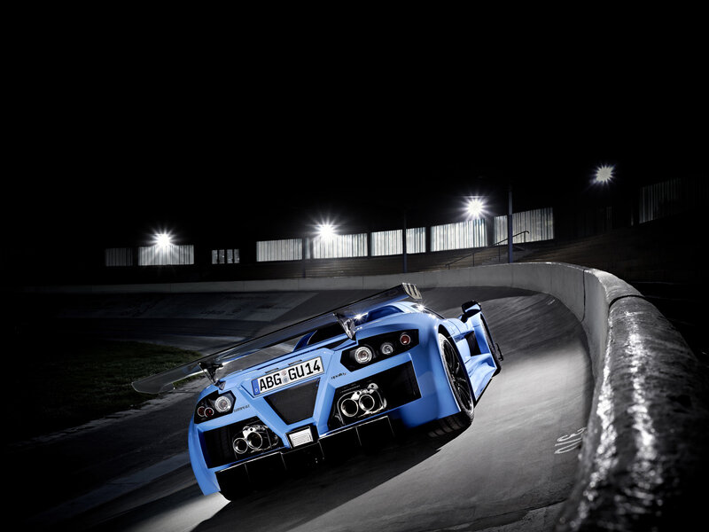 Blue Sports Car on Track — Dramatic