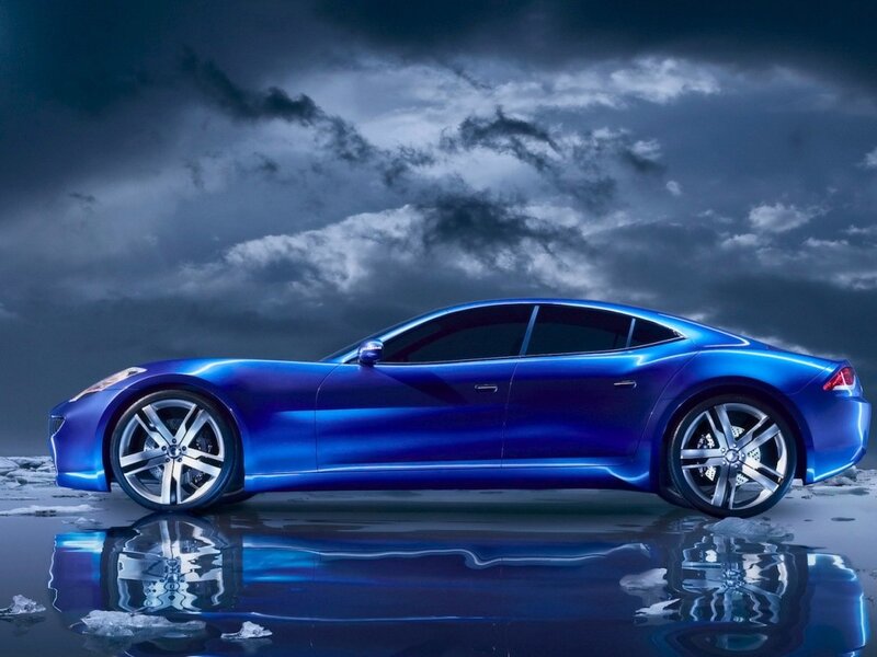 blue sports car on wet surface