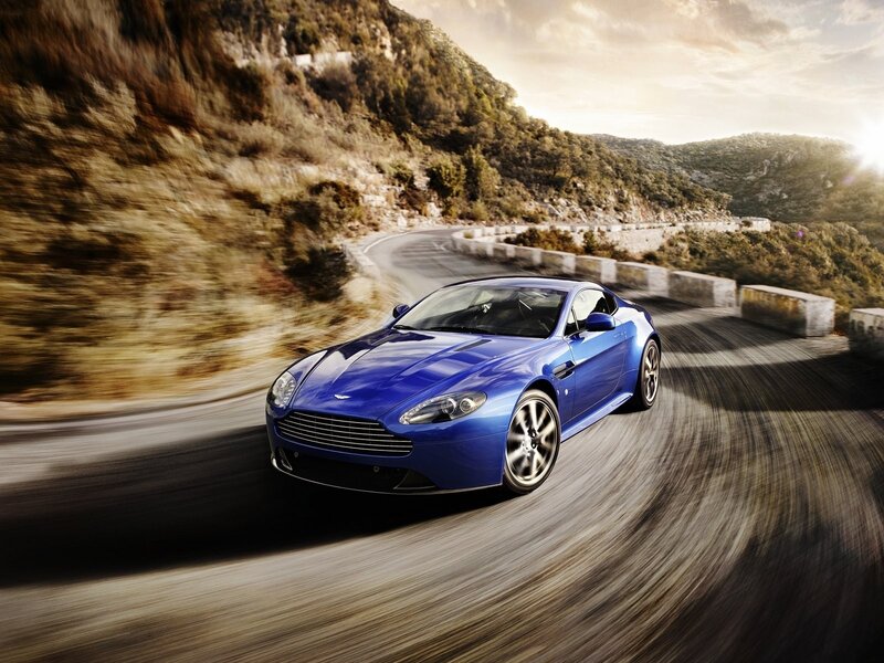 Blue sports car on winding road