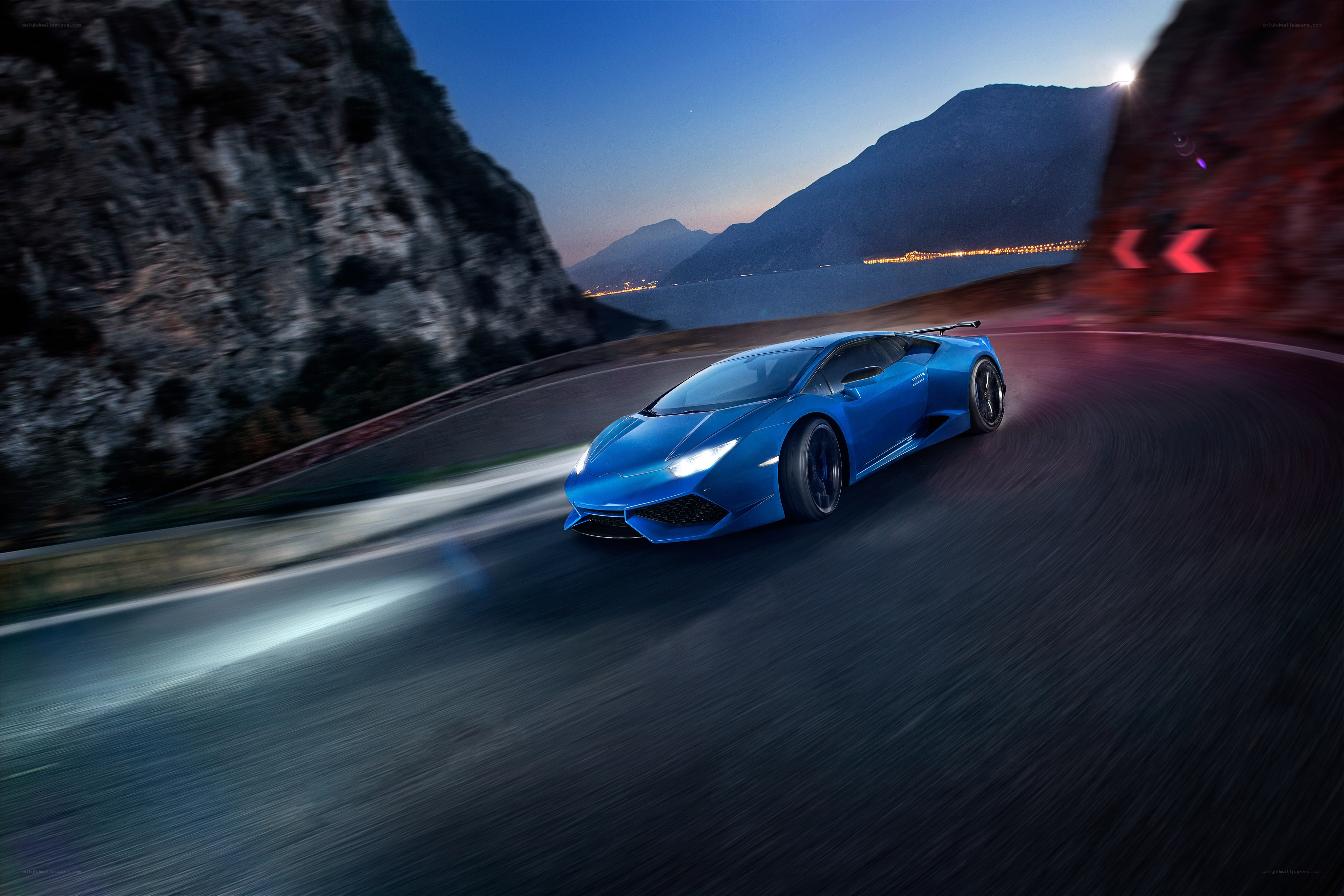 Blue sports car on winding road