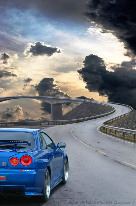 Blue sports car on winding road