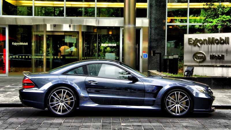 Blue sports car outside building