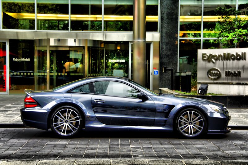 Blue sports car outside ExxonMobil building
