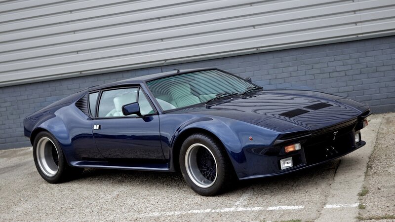 blue sports car parked outside